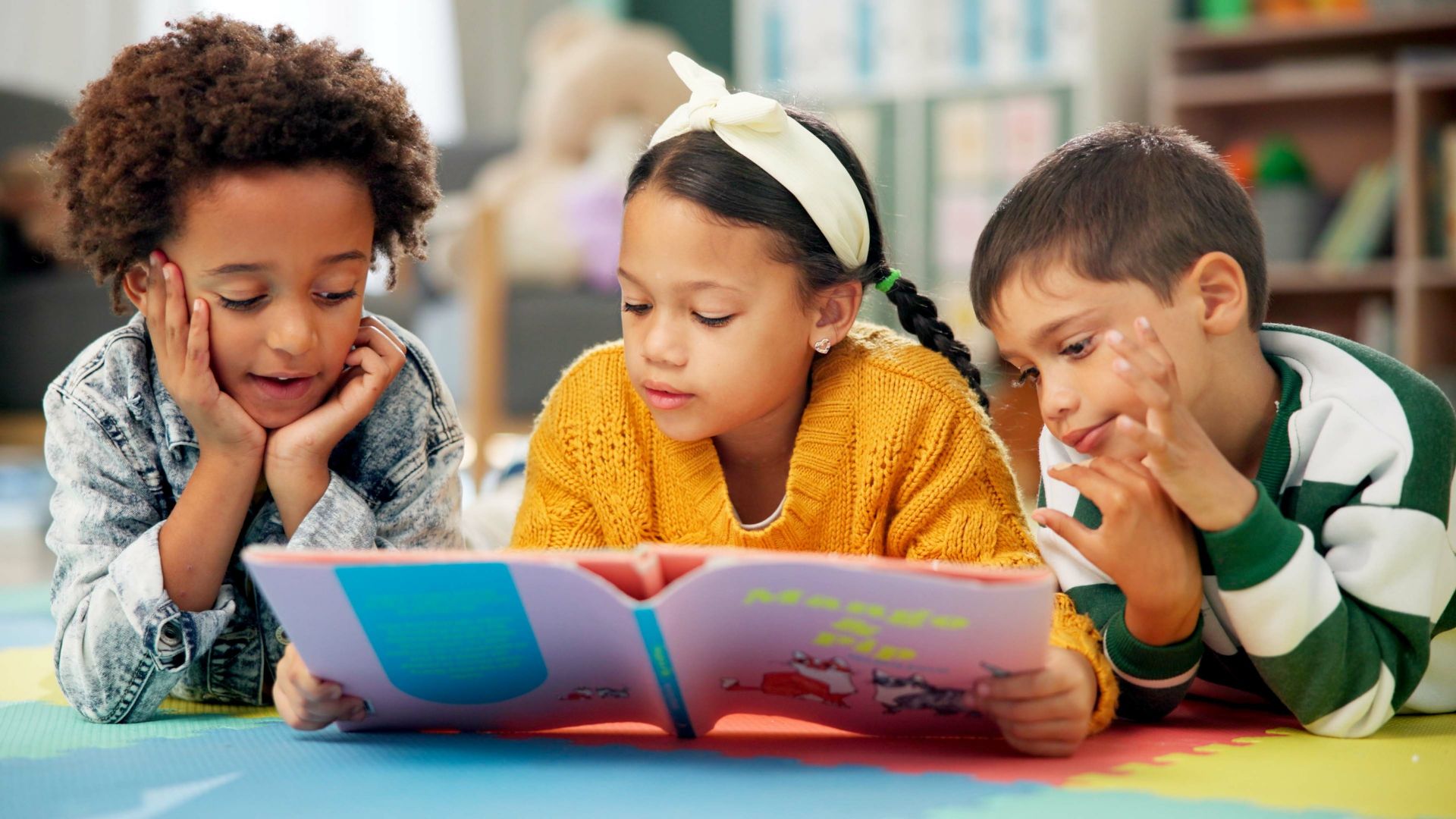 Three students reading together