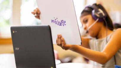 Ignite Reading tuoring student interacting with tutor while showing the word 'Misjudge' she spelt on her whiteboard