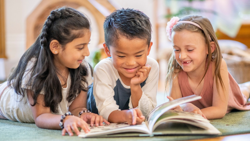 Three kids reading together