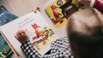 Kid reading childrens book