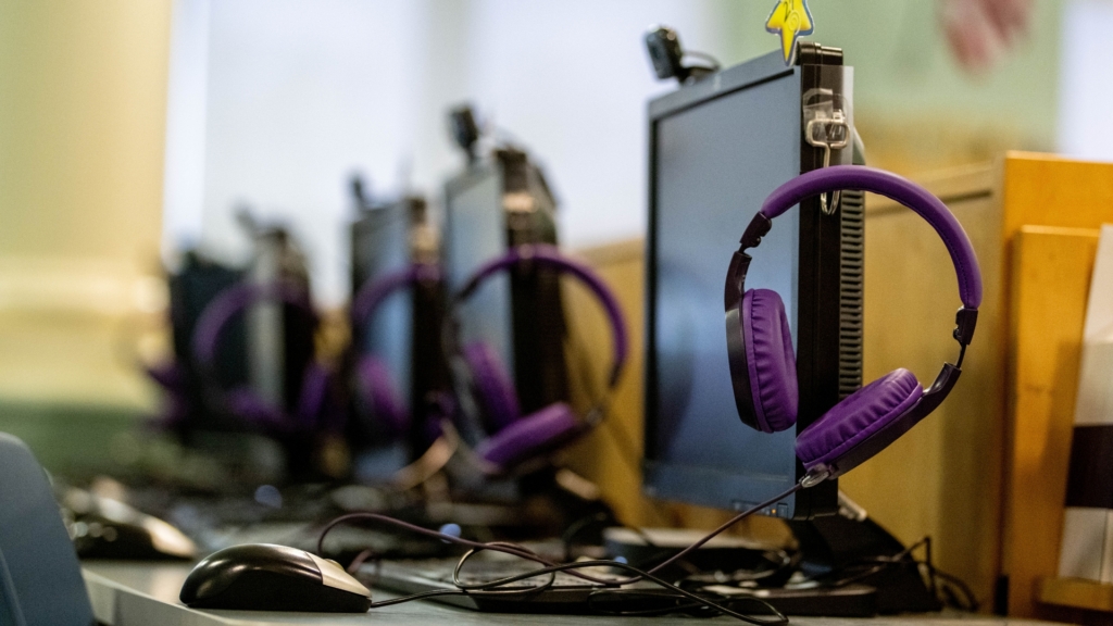 Computer screens with Ignite Reading headphones