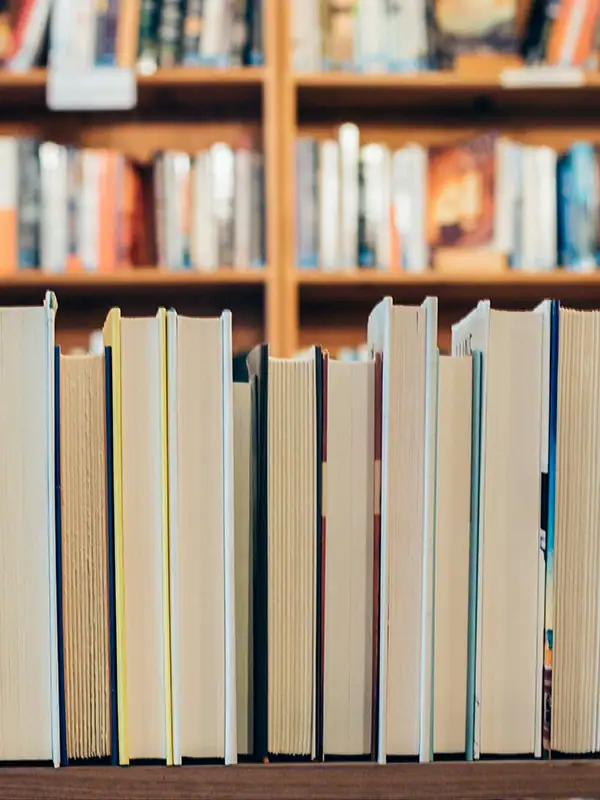 How to Boost Family Engagement in Reading — Tips for Districts & Schools 6 Books lined up on a shelf