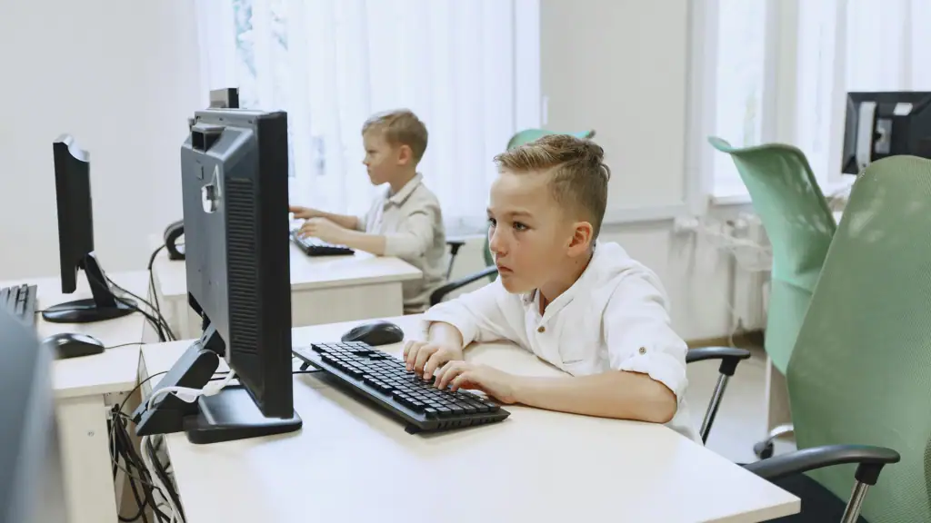Boy Typing On Computer