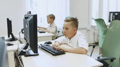 Boy Typing On Computer