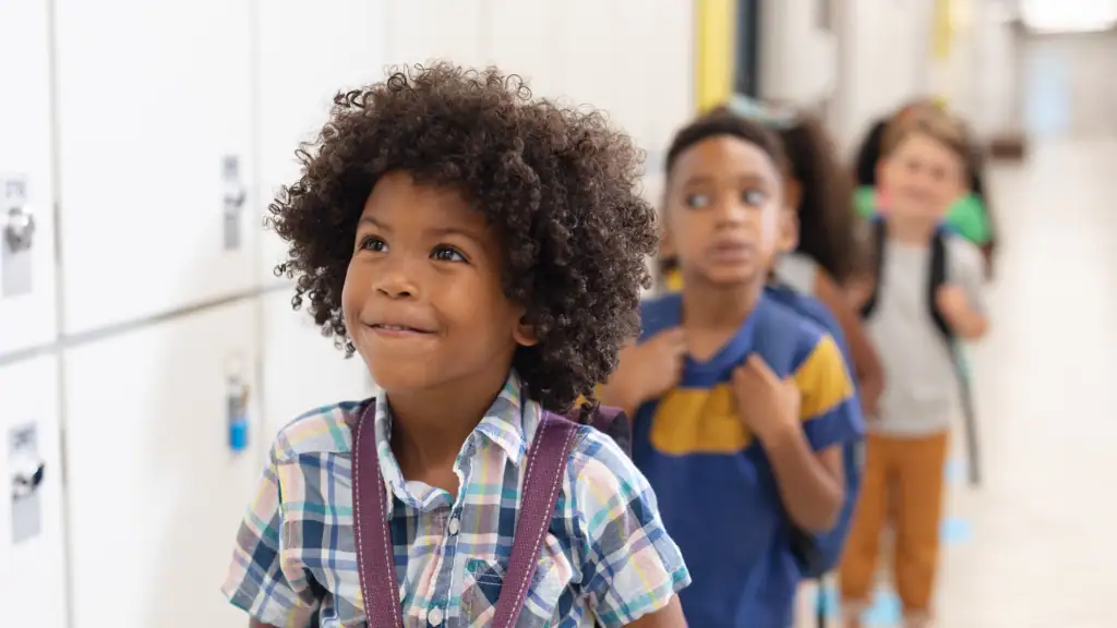 Children In A Line In School Hallway