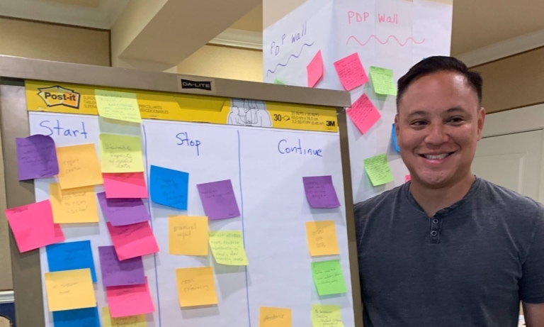 Employee at Post-It Note Board