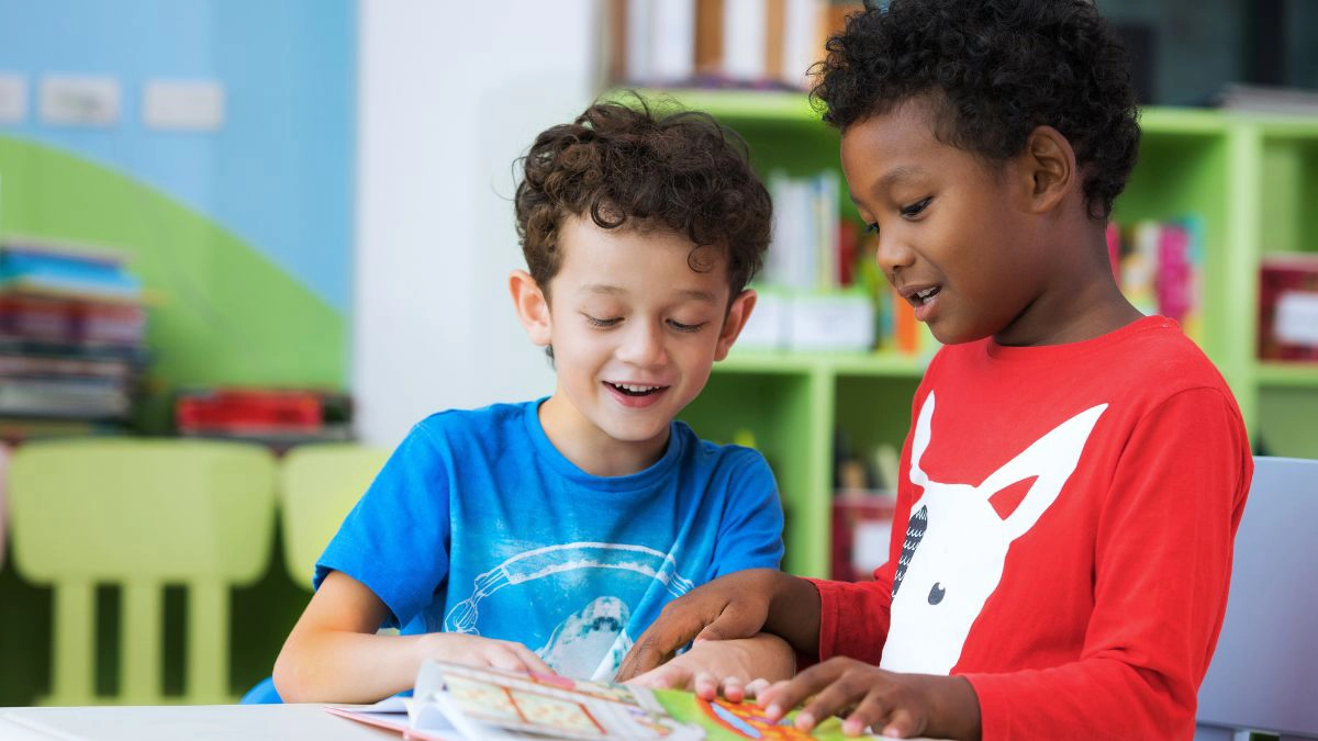 Two boys reading in a classroom