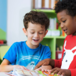 Two boys reading in a classroom