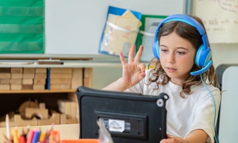 Girl Student Showing Ok Sign To Tablet