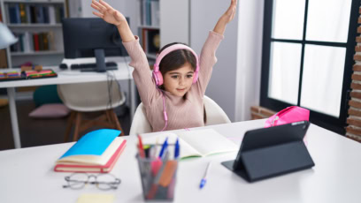 Girl Tutoring On Ipad In Empty Classroom