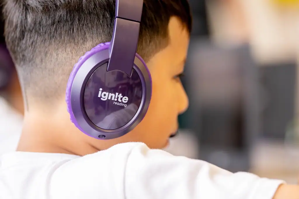 Ignite Reading Student wearing headphones