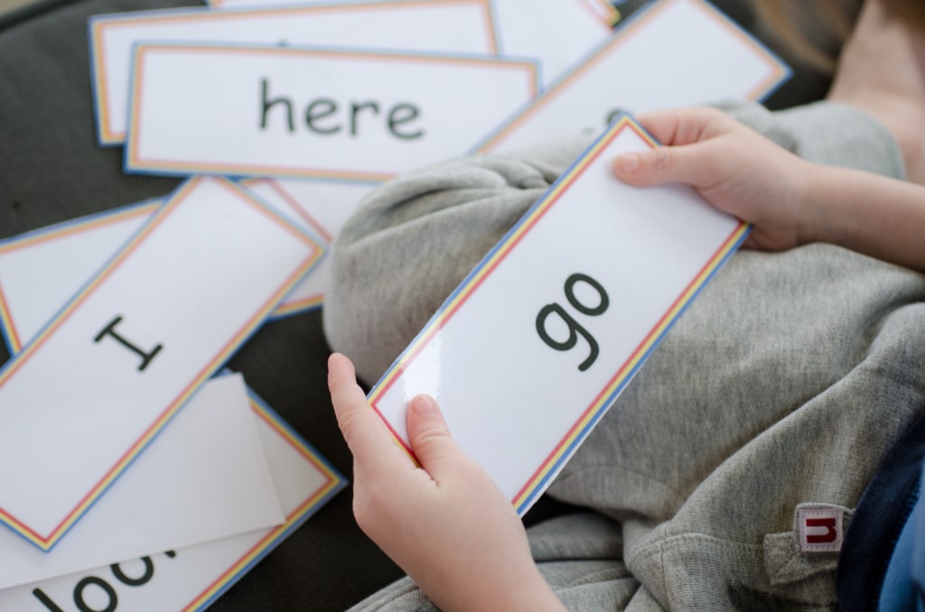 Child with High Frequency Word Flash Cards