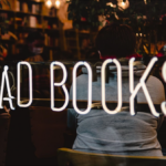 An LED sign with & read books at the front of a bookstore