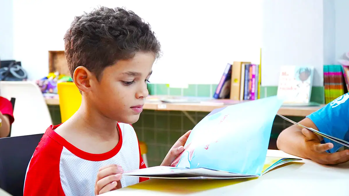 student reading book during reading interventions block