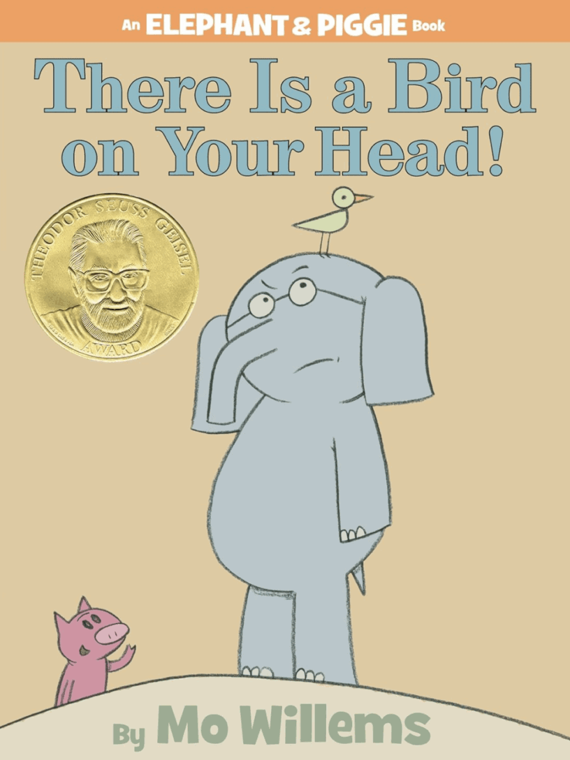 A peach-colored book cover with a drawing of a gray elephant with a yellow bird on his head, a pink pig staring up at him, and the title "There Is A Bird On Your Head"