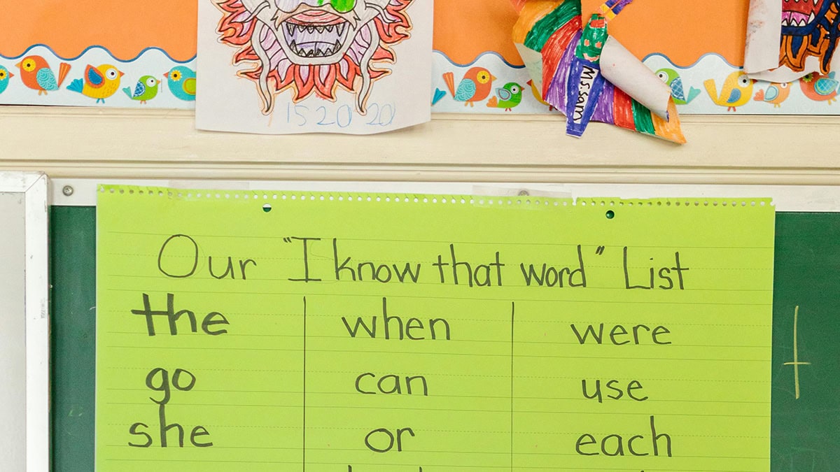 A sight words list hangs in a classroom