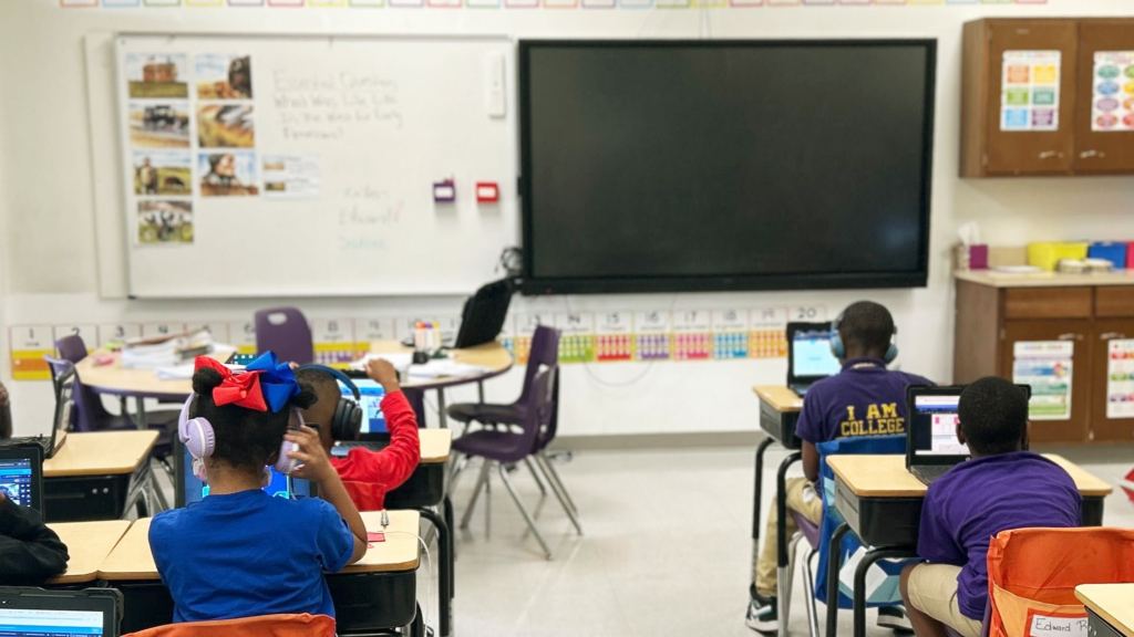 Students In High Impact Tutoring sit in a classroom