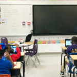 Students In High Impact Tutoring sit in a classroom