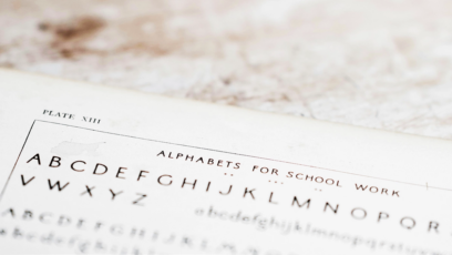 old alphabets for school worksheet used for teaching kids how to read sits on a table