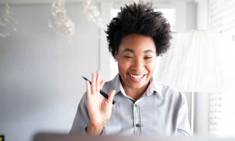 Tutor Waving Hello During Remote Tutoring Session